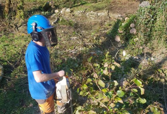 man holding a chainsaw